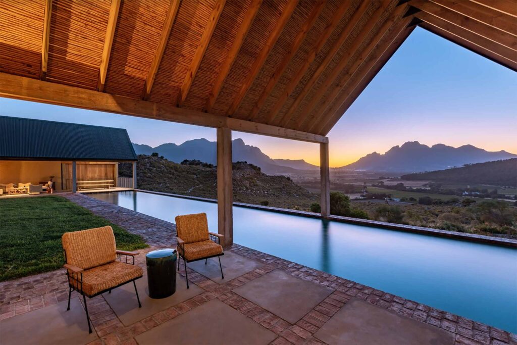 Sunset over the main pool at 7 Koppies, Franschhoek, South Africa