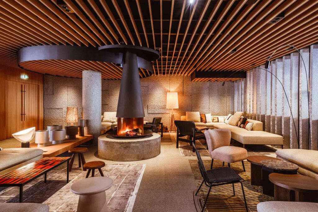 A fireplace and cosy lounge area at Altapura, Val Thorens, Les Trois Vallées, France