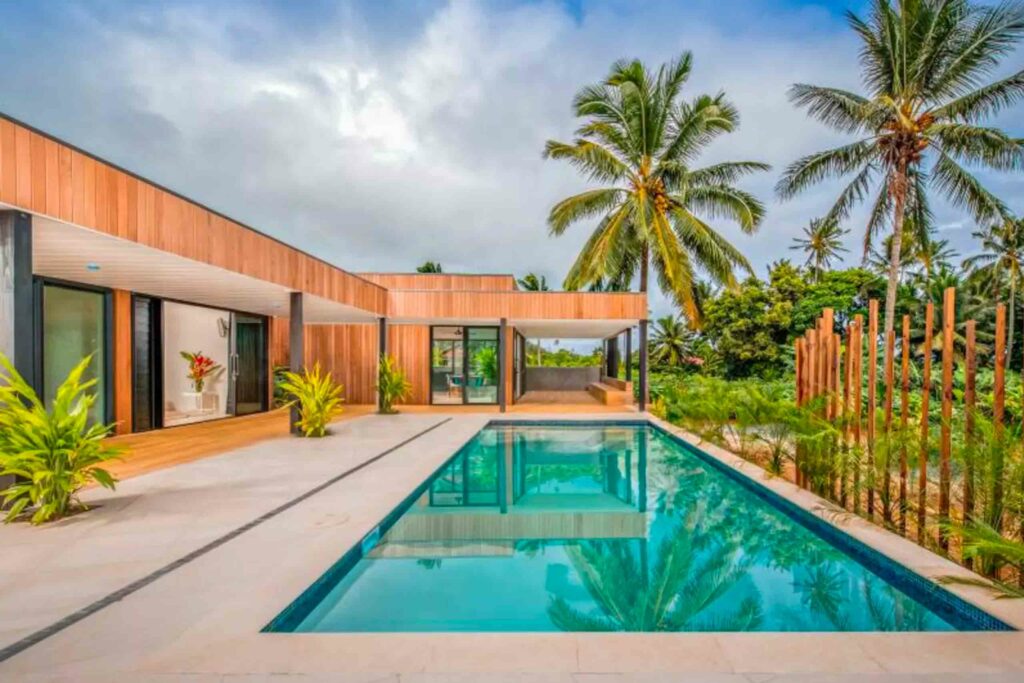 A luxury resort with an outdoor pool in the Cook Islands.