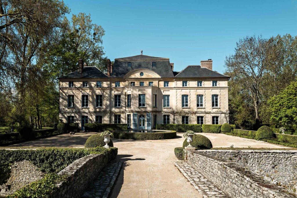 Exterior of Domaine de Primard Guainville at the end of a grand driveway.