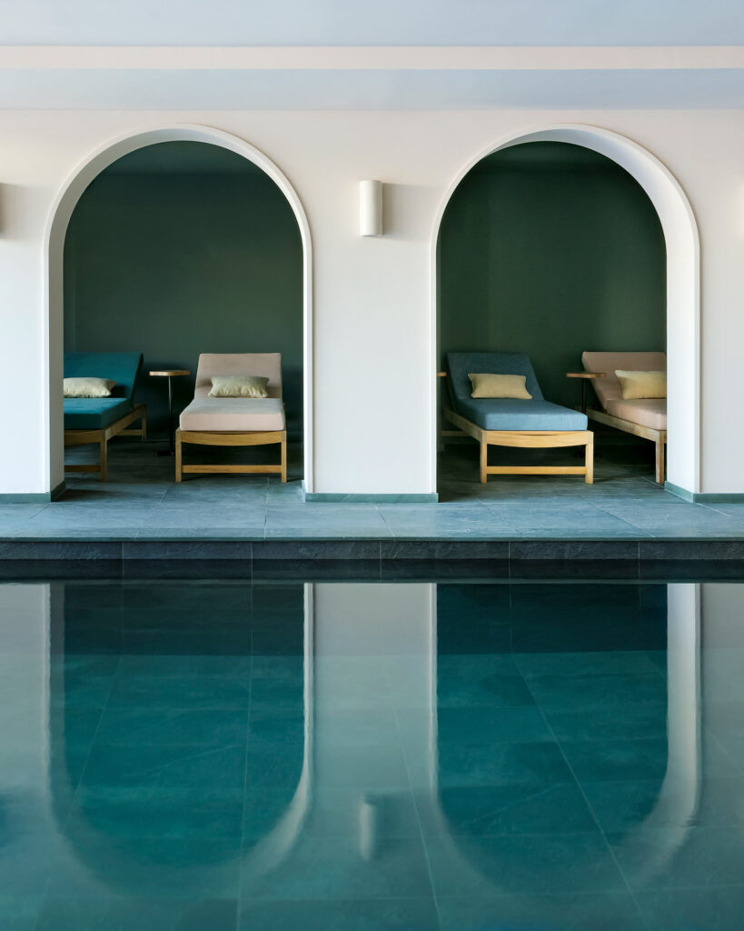 Loungers by the indoor pool at Hotel Le Coucou, Méribel, France