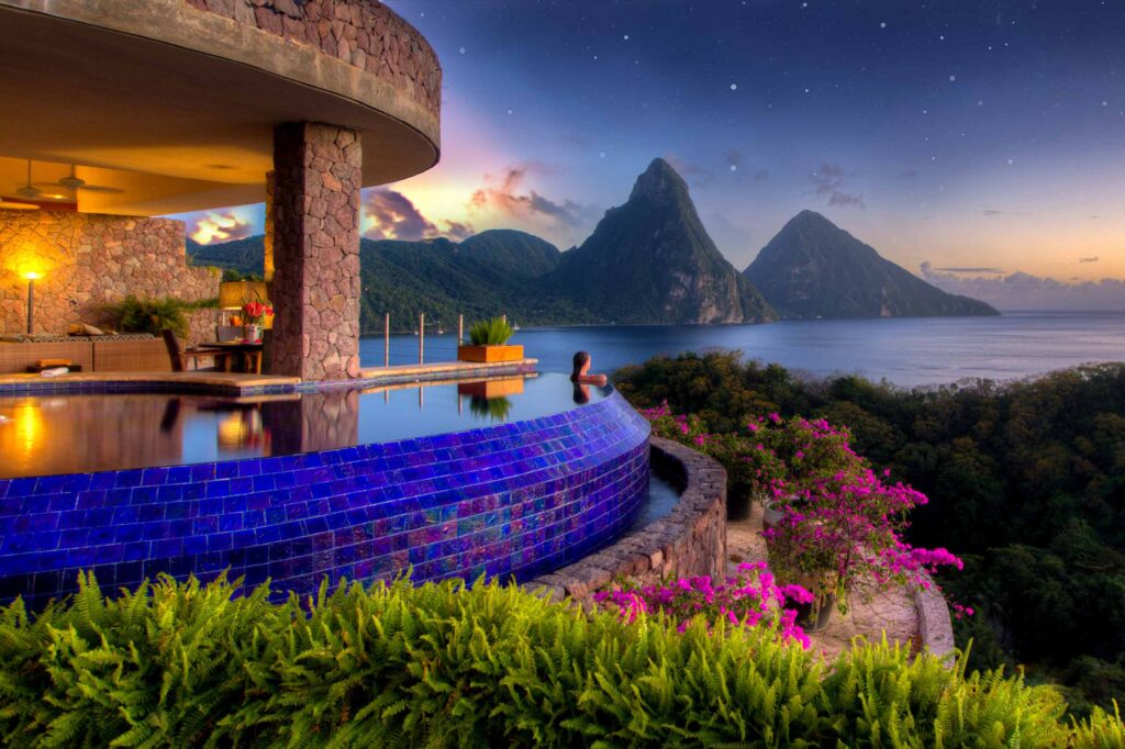A visitor enjoys the view from her guest sanctuary at Jade Mountain, Soufriere, St Lucia