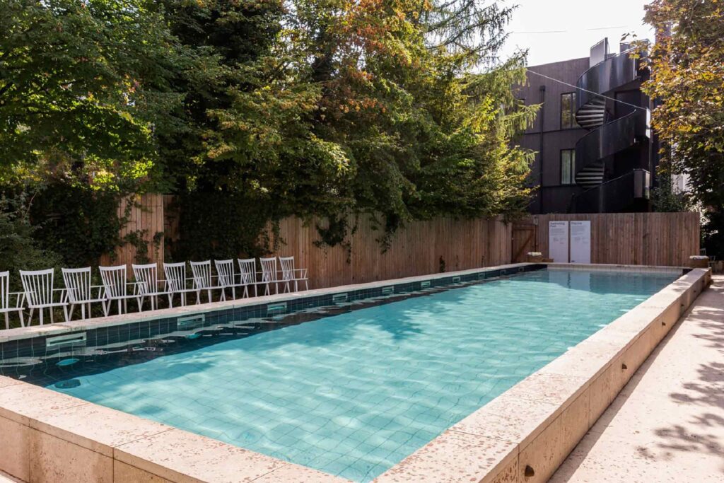 An outdoor pool at Mob House - Chic stays outside of Paris.