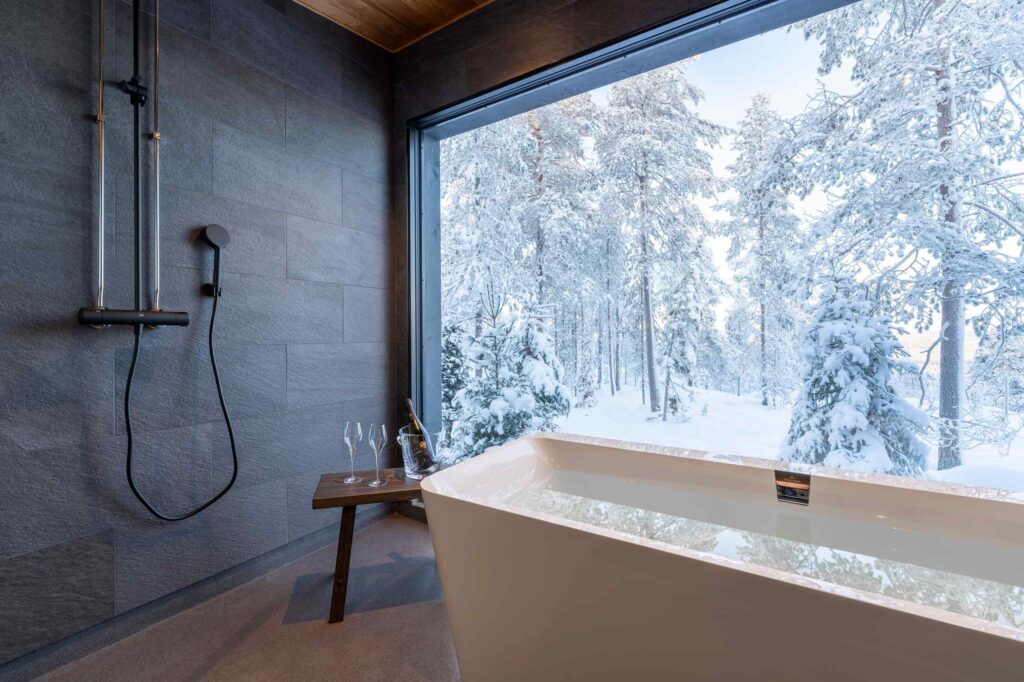 A bathtub with a view of snowy Finnish Lapland at Octola, Finland