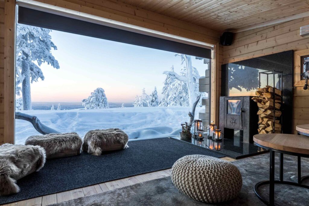 A fireplace with a view of snowy Finnish Lapland, Finland
