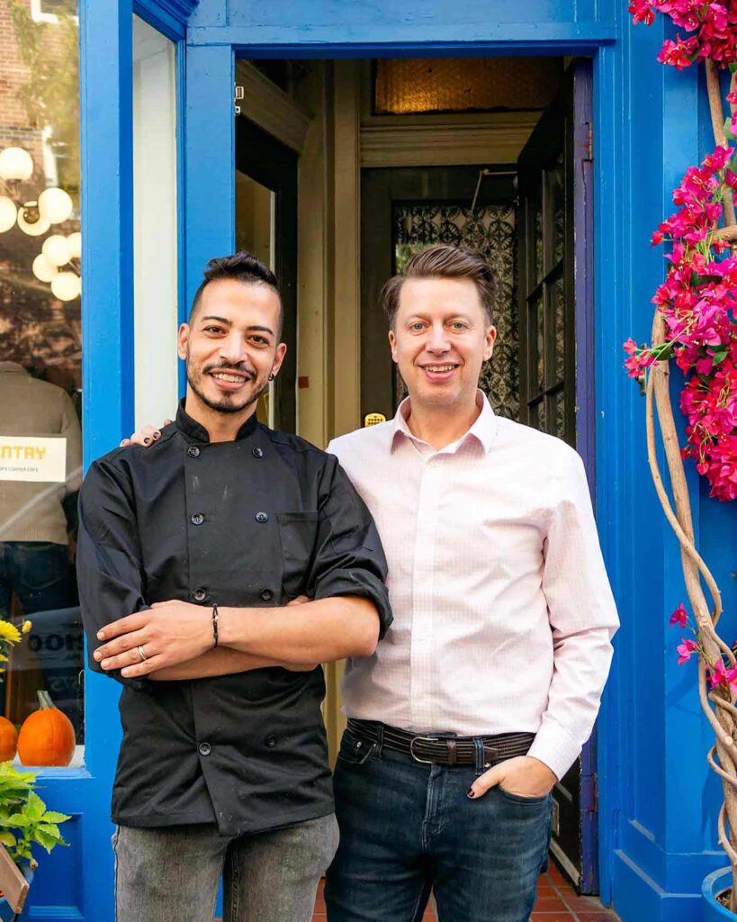 The owners of Sofi Corner Cafe pose for a picture in Philadelphia, Pennsylvania, USA