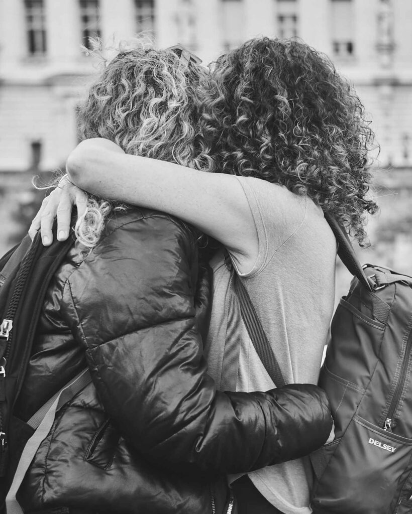 A lesbian couple embraces in the streets, one of many postcards from Paris, France