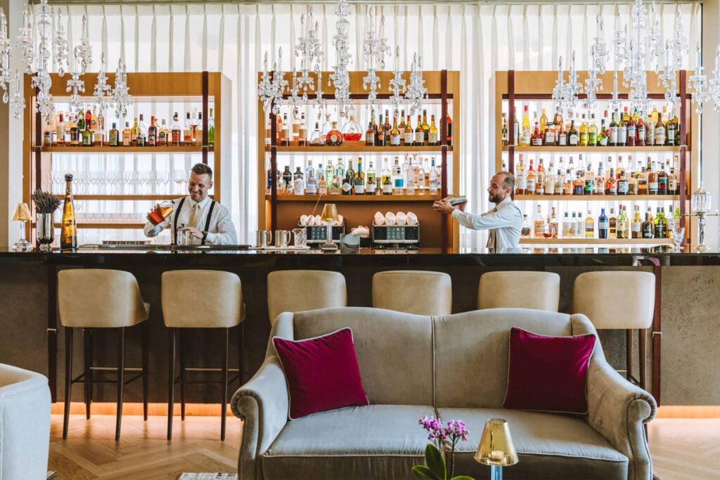 A bar with two bartenders at the Royal Champagne Hotel & Spa.