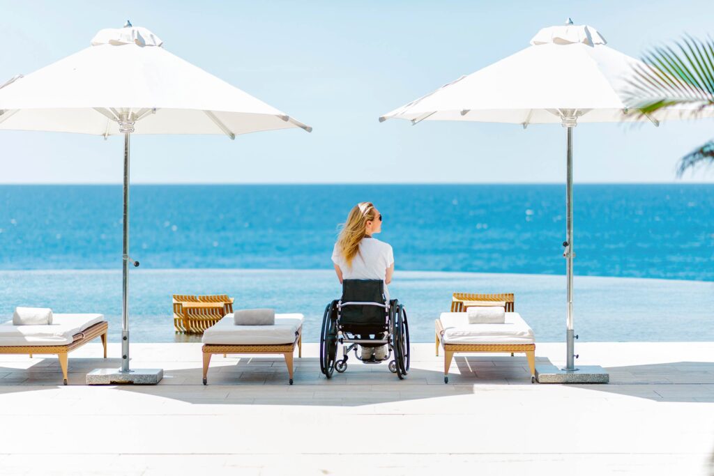 Disabled holidaymaker by a pool in the Maldives