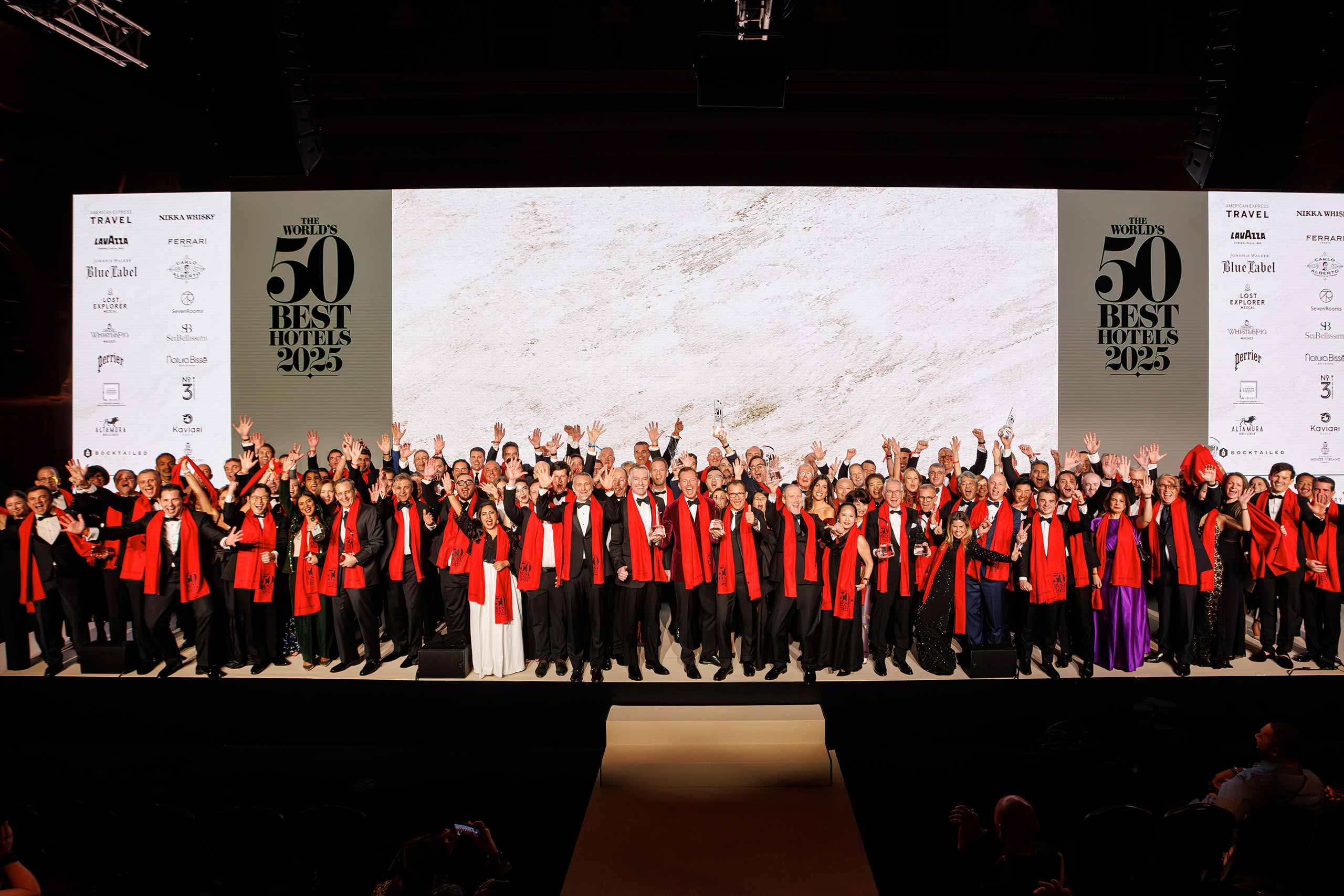 Hoteliers pose on stage at The Worlds 50 Best Hotels 2025