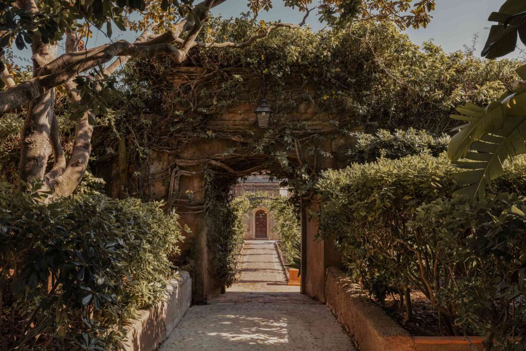 Landscaped archway covered in greenery at Le Grande Jardin Cannes by Ultima Collection